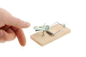 Mousetrap with dollar and finger